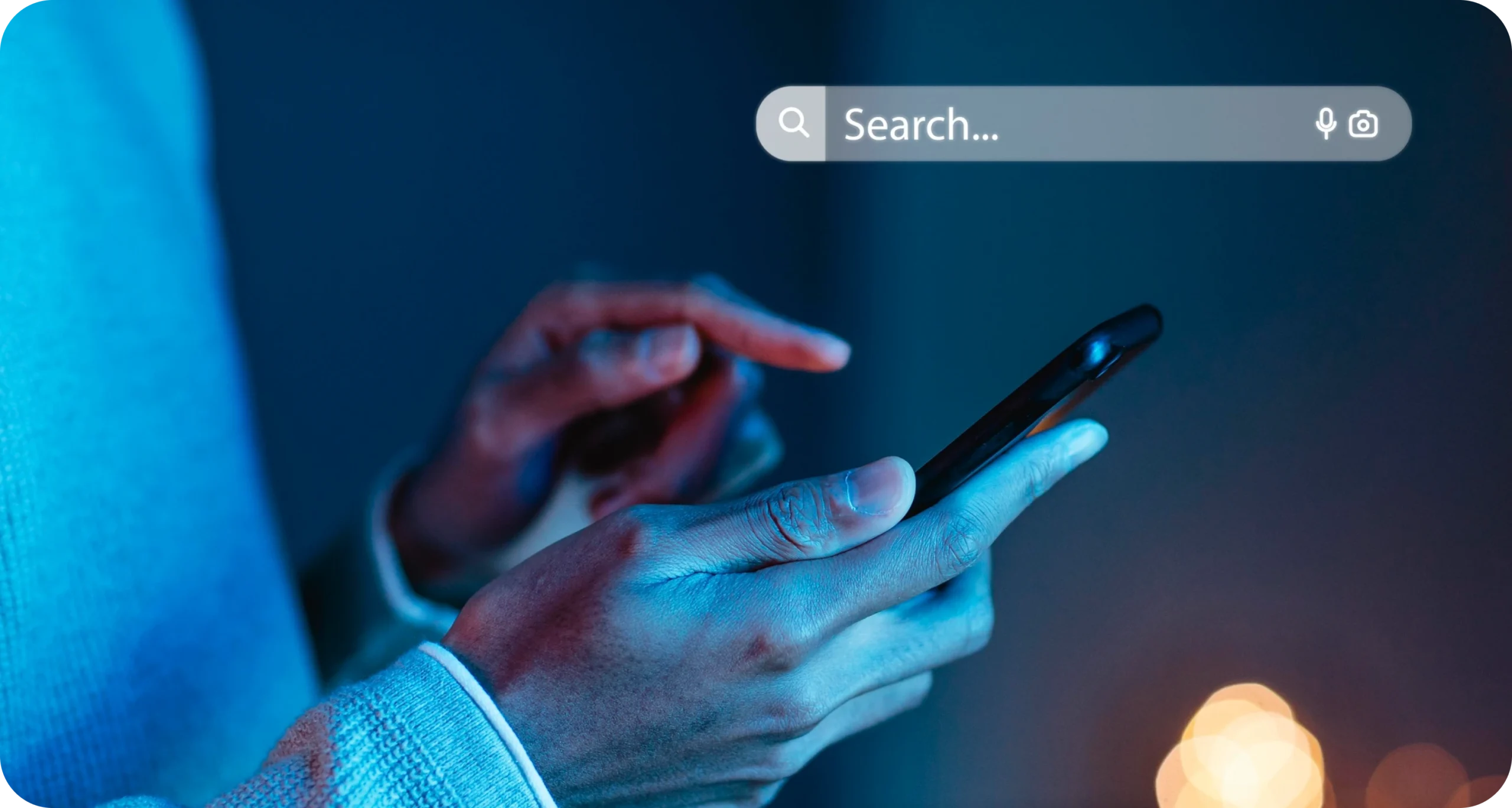 Person using mobile phone with search bar interface, representing Search Engine Optimization and digital search trends