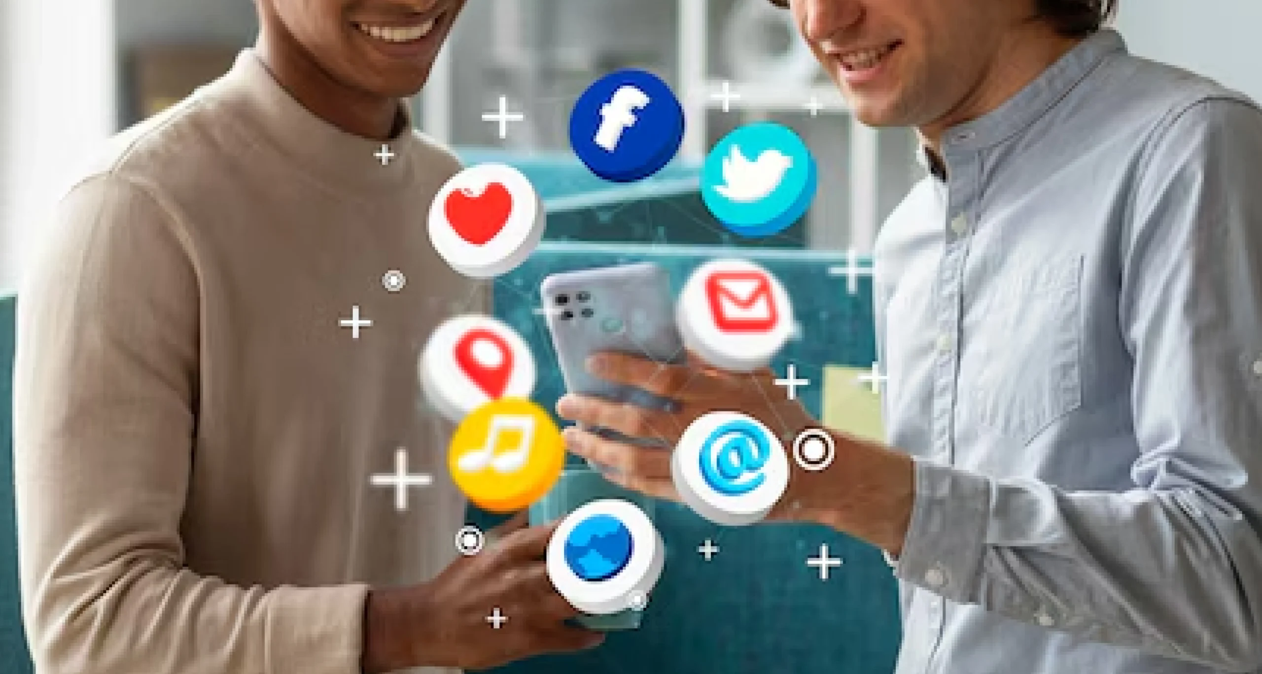 Two men smiling and interacting with a smartphone surrounded by floating digital icons—illustrating how Local SEO + Social Media Is a Game-Changer for Hyderabad businesses.