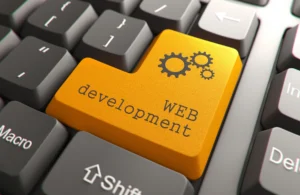 Keyboard with a highlighted web development key symbolizing common mistakes hiring web developers for digital projects.